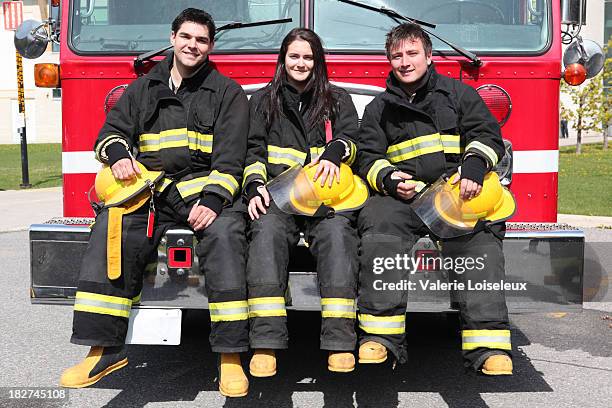 three firefighters - firefighter boot stock pictures, royalty-free photos & images
