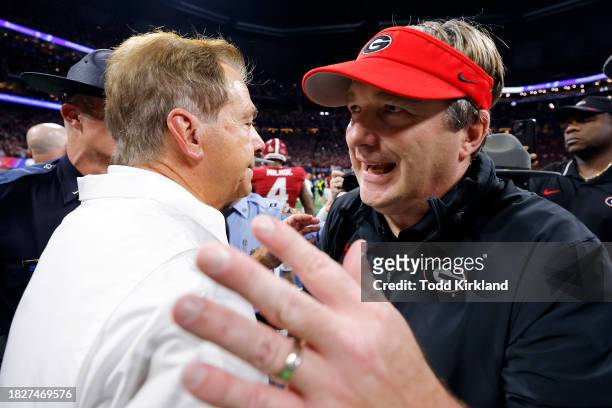 Head coach Nick Saban of the Alabama Crimson Tide shakes hands with Head coach Kirby Smart of the Georgia Bulldogs after defeating the Georgia...