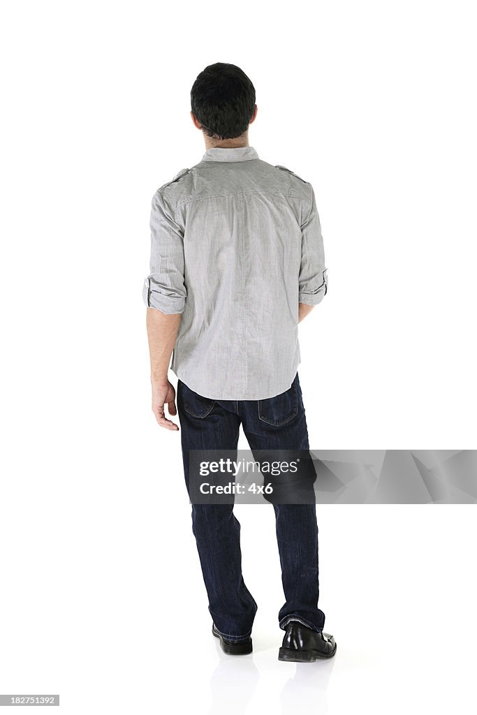 Rear view of an isolated casual male