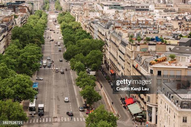 elevated view from arc de triomphe of the elegant street in paris. - place charles de gaulle stock pictures, royalty-free photos & images
