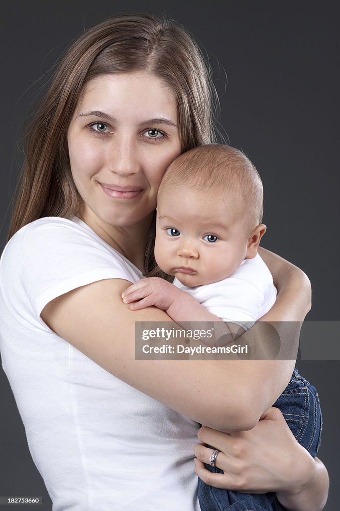 Smiling Mother Holding Baby