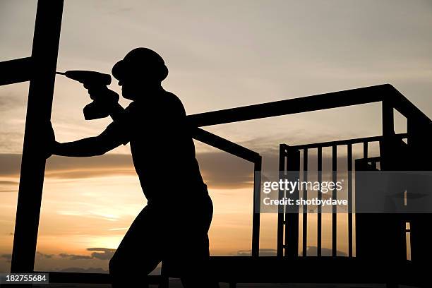 eröffnet im morgengrauen - building silhouette stock-fotos und bilder