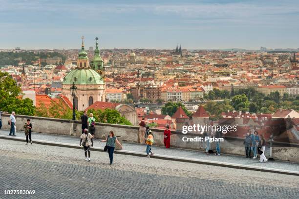 prague city skyline with the towers of the church of saint nicholas, czech republic - st vitus cathedral prague stock pictures, royalty-free photos & images