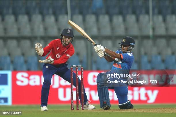 Kanika Ahuja of India plays a shot during the 1st T20 International match between India Women and England Women at Wankhede Stadium on December 6,...
