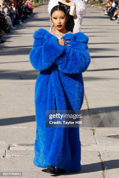 Cardi B walks the runway down South Windsor Boulevard during the Balenciaga Fall 2024 fashion show on December 02, 2023 in Los Angeles, California.