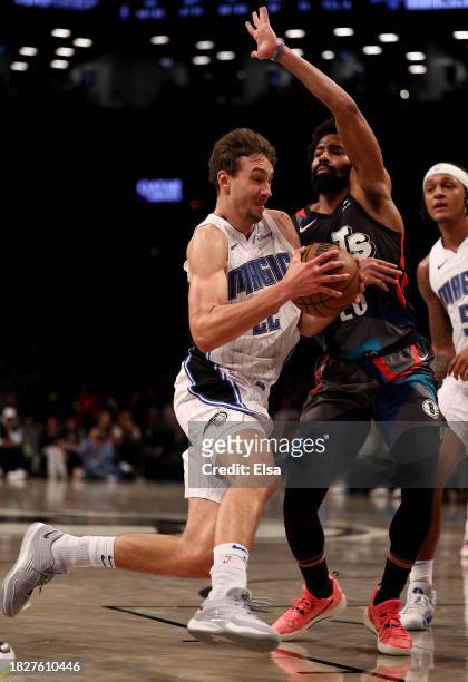 Franz Wagner of the Orlando Magic heads for the net as Spencer Dinwiddie of the Brooklyn Nets defends during the second half at Barclays Center on...