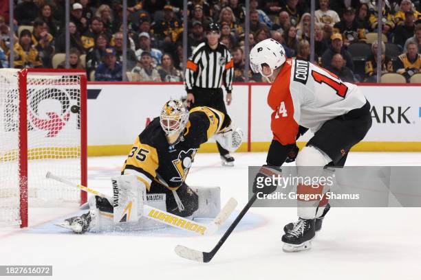 Sean Couturier of the Philadelphia Flyers scores a shootout goal past Tristan Jarry of the Pittsburgh Penguins to secure a 4-3 win at PPG PAINTS...