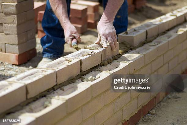 building... - mason bricklayer stock pictures, royalty-free photos & images