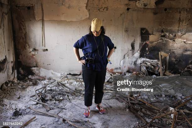 Sharone Lifschitz, surveys the burnt-out home of her parents, who were kidnapped by Hamas militants on Oct. 7, in Kibbutz Nir Oz, Israel, on...