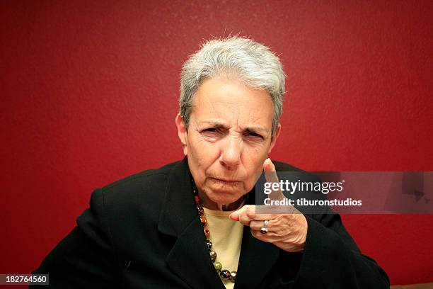 silver grey haired woman disciplining you - woman shaking finger stock pictures, royalty-free photos & images