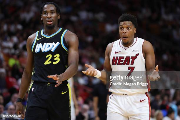 Aaron Nesmith of the Indiana Pacers and Kyle Lowry of the Miami Heat react during the second quarter of the game at Kaseya Center on December 02,...