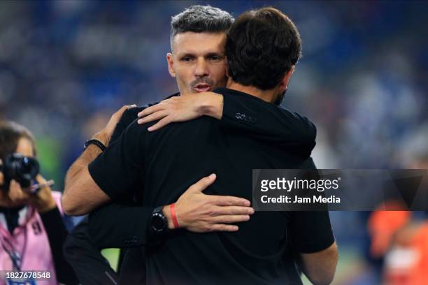 Fernando Ortiz , head coach of Monterrey, and Gustavo Da Silva , head coach of San Luis hug prior the quarterfinals second leg match between...