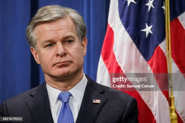 Director Christopher Wray looks on during a press conference at the U.S. Department of Justice on December 6, 2023 in Washington, DC. The Department...