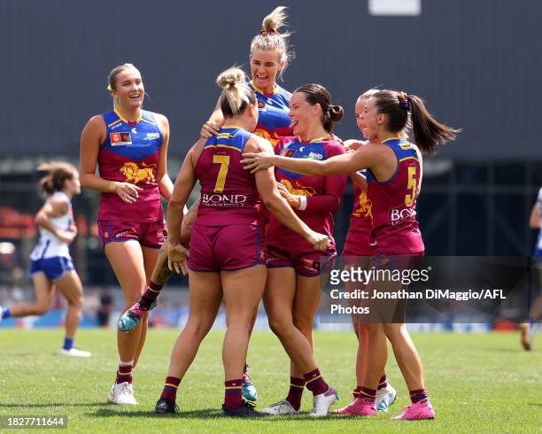 Ellie Hampson of the Lions celebrates a goal with teammates during the AFLW Grand Final match between North Melbourne Tasmania Kangaroos and Brisbane...