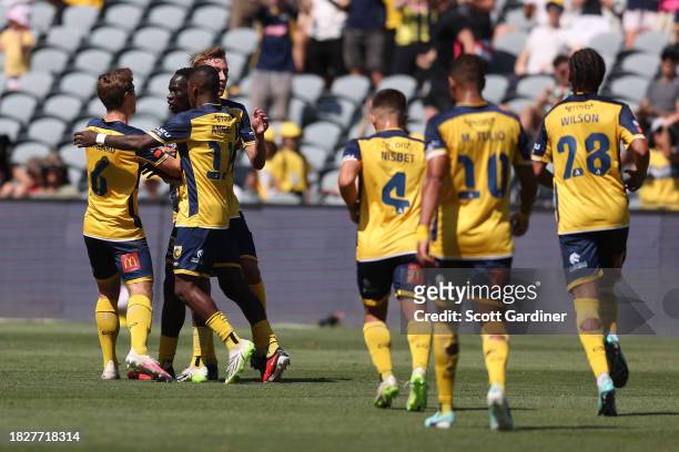 Alou Kuol of the Mariners celebrates a goal with teammates during the A-League Men round six match between Central Coast Mariners and Melbourne...