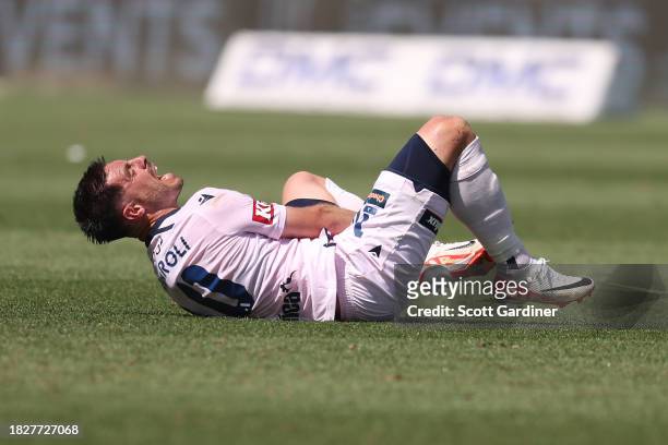 Bruno Fornaroli Mezza of Melbourne Victory reacts following a tackle during the A-League Men round six match between Central Coast Mariners and...