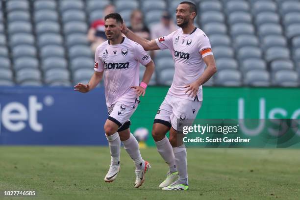 Bruno Fornaroli Mezza celebrates a goal with Roderick Miranda of Melbourne Victory during the A-League Men round six match between Central Coast...