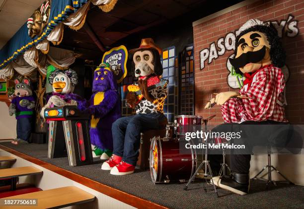 Left to right-"Chuck E. Cheese," "Helen Henny," "Mr. Munch," "Jasper Jowels," and "Pasqually," members of the animatronic band at the Chuck E. Cheese...