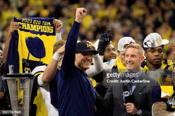 Head coach Jim Harbaugh of the Michigan Wolverines celebrates after a winning the Big Ten Championship over the Iowa Hawkeyes at Lucas Oil Stadium on...