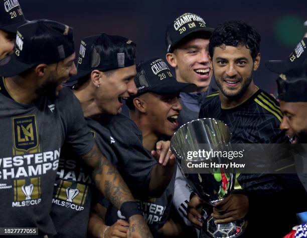Captain Carlos Vela of Los Angeles FC makes his way to the front of the podium with the trophy after a 2-0 win over the Houston Dynamo in the Western...