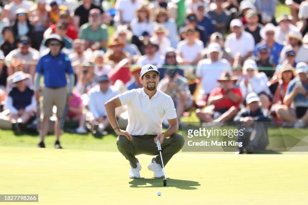 Joaquin Niemann of Chile reacts as a bird interrupts while lining up a putt on the 18th green during the ISPS HANDA Australian Open at The Australian...