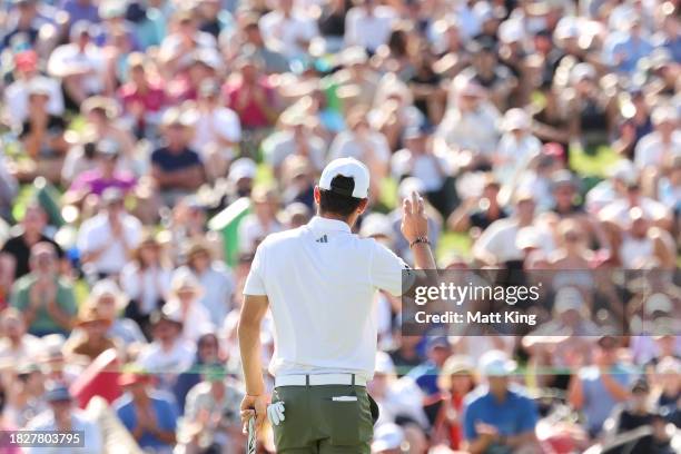 Joaquin Niemann of Chile acknowledges the crowd after putting on the 18th green during the ISPS HANDA Australian Open at The Australian Golf Course...