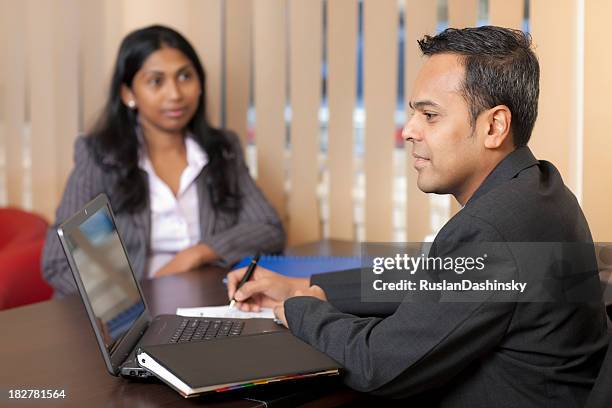 two businessmen holding a meeting - sri lankan culture stock pictures, royalty-free photos & images