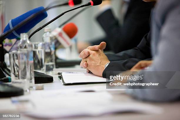 presentation - press conference table stock pictures, royalty-free photos & images