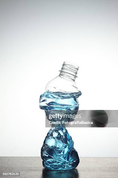 crushed bottle - crushed plastic stock pictures, royalty-free photos & images