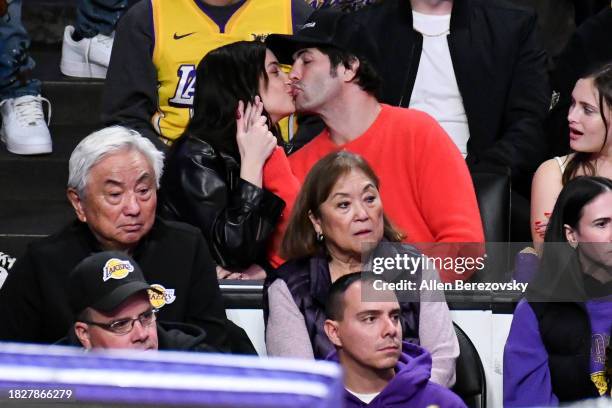 Ashley Benson and Brandon Davis attend a basketball game between the Los Angeles Lakers and the Houston Rockets at Crypto.com Arena on December 02,...