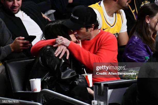 Ashley Benson and Brandon Davis attend a basketball game between the Los Angeles Lakers and the Houston Rockets at Crypto.com Arena on December 02,...