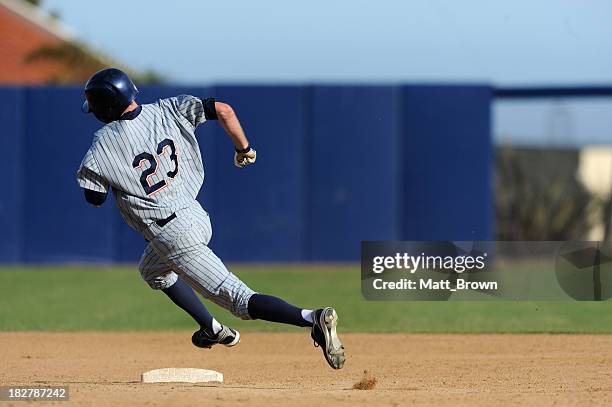 rounding second base - baseball player running stock pictures, royalty-free photos & images