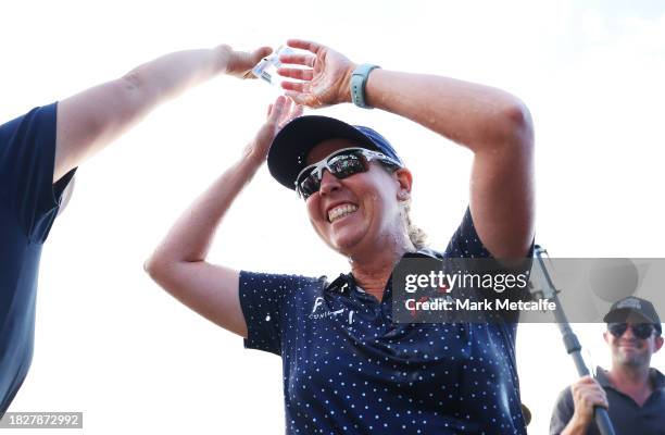 Ashleigh Buhai of South Africa is showered by Jiyai Shin of South Korea after winning The Women's ISPS HANDA Australian Open and her back to back...