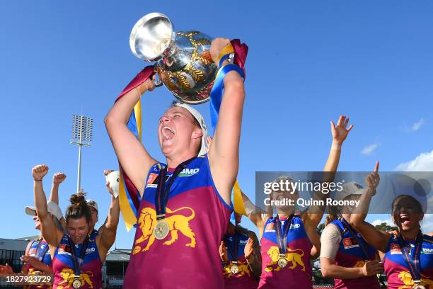 Dakota Davidson of the Lions celebrates with the premiership Cup during the AFLW Grand Final match between North Melbourne Tasmania Kangaroos and...