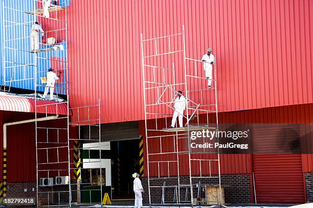 industrial painters painting factory - facade painting stock pictures, royalty-free photos & images