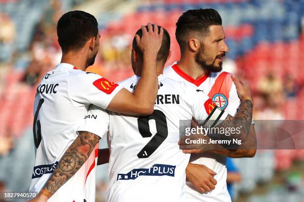 Jaime Maclaren of Melbourne City celebrates scoring a goal with this teammates during the A-League Men round six match between Newcastle Jets and...