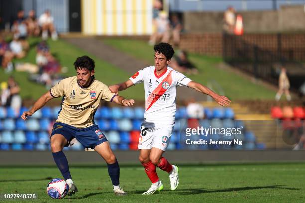 Ben Mazzeo of Melbourne City and Kostandinos Grozos of the Jets challenges for the ball during the A-League Men round six match between Newcastle...