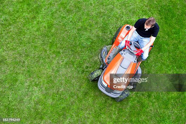 overhead shot of gardener mowing lawn with ride on mower - gräsklippning bildbanksfoton och bilder