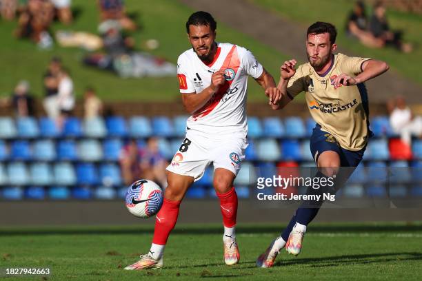 Hamza Sakhi of Melbourne City and Thomas Aquilina of the Jets challenge for the ball during the A-League Men round six match between Newcastle Jets...