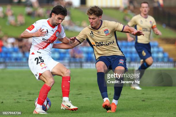 Callum Talbot of Melbourne City and Lucas Mauragis of the Jets challenge for the ball during the A-League Men round six match between Newcastle Jets...
