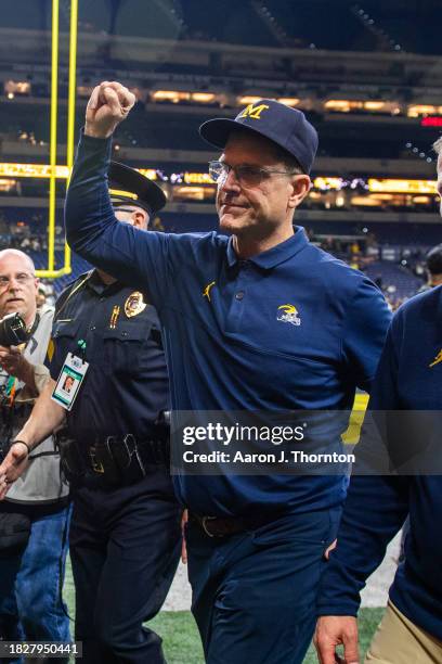 Head Football Coach Jim Harbaugh of the Michigan Wolverines reacts after winning the Big Ten Championship against the Iowa Hawkeyes at Lucas Oil...