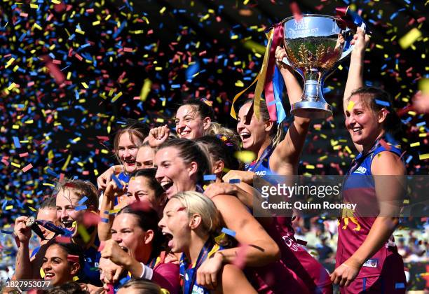 The Lions pose with the Premiership Trophy during the AFLW Grand Final match between North Melbourne Tasmania Kangaroos and Brisbane Lions at Ikon...