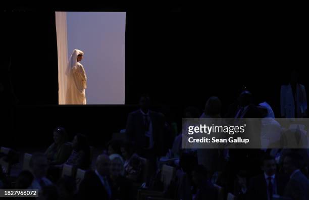 Participants arrive at the Health Day Opening Session at Al Waha Theatre on day four of the UNFCCC COP28 Climate Conference at Expo City Dubai on...