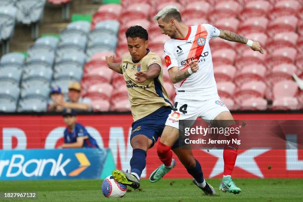 Dane Ingham of the Jets and Marin Jakolis of Melbourne City contest for the ball during the A-League Men round six match between Newcastle Jets and...