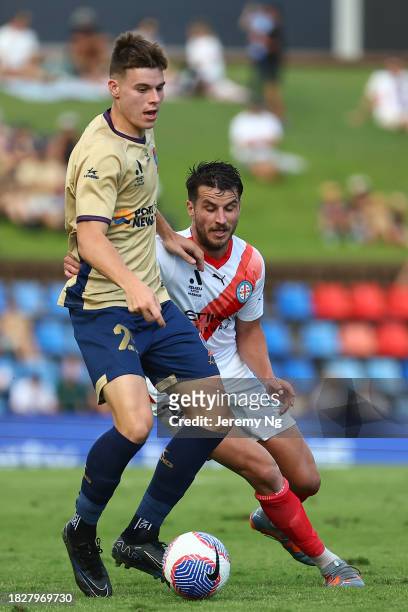 Terry Antonis of Melbourne City and Justin Vidic of the Jets challenge for the ball during the A-League Men round six match between Newcastle Jets...