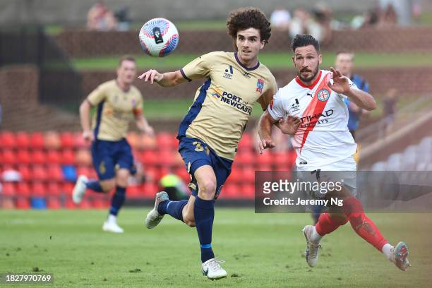 Mark Natta of the Jets and Mathew Leckie of Melbourne City challenge for the ballduring the A-League Men round six match between Newcastle Jets and...