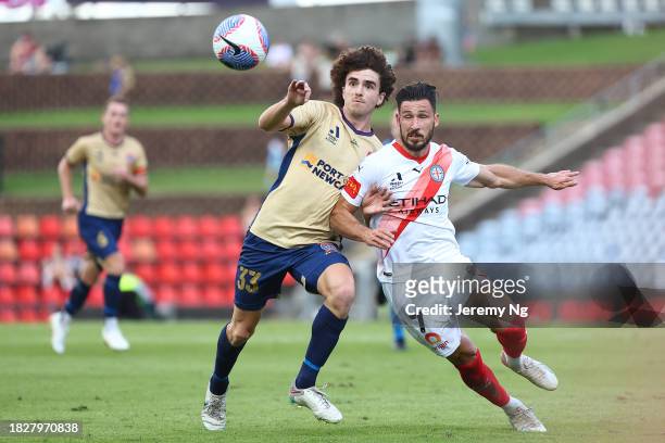 Mark Natta of the Jets and Mathew Leckie of Melbourne City challenge for the ball during the A-League Men round six match between Newcastle Jets and...