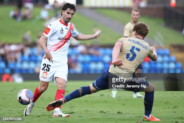 Callum Talbot of Melbourne City and Lucas Mauragis of the Jets challenge for the ball during the A-League Men round six match between Newcastle Jets...