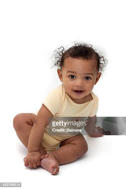 feliz sonriente bebé en amarillo - girl sitting on boys face fotografías e imágenes de stock
