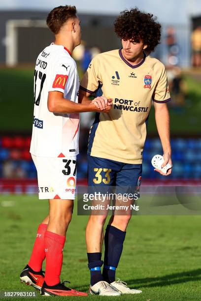 Mark Natta of the Jets and Max Caputo of Melbourne City exchanges pleasantries at full time after the A-League Men round six match between Newcastle...